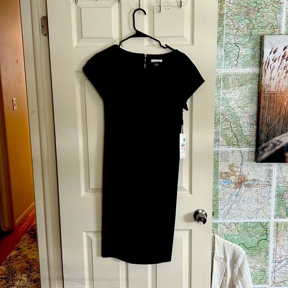 Calvin Klein, size 10, little black dress, never worn, figure flattering ,